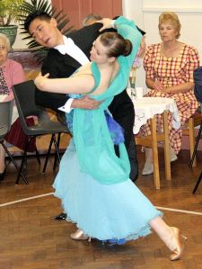 A couple ballroom dancing